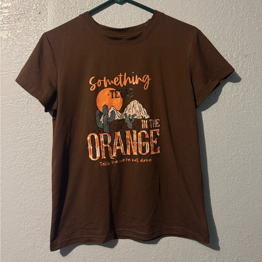 Something in the orange shirt